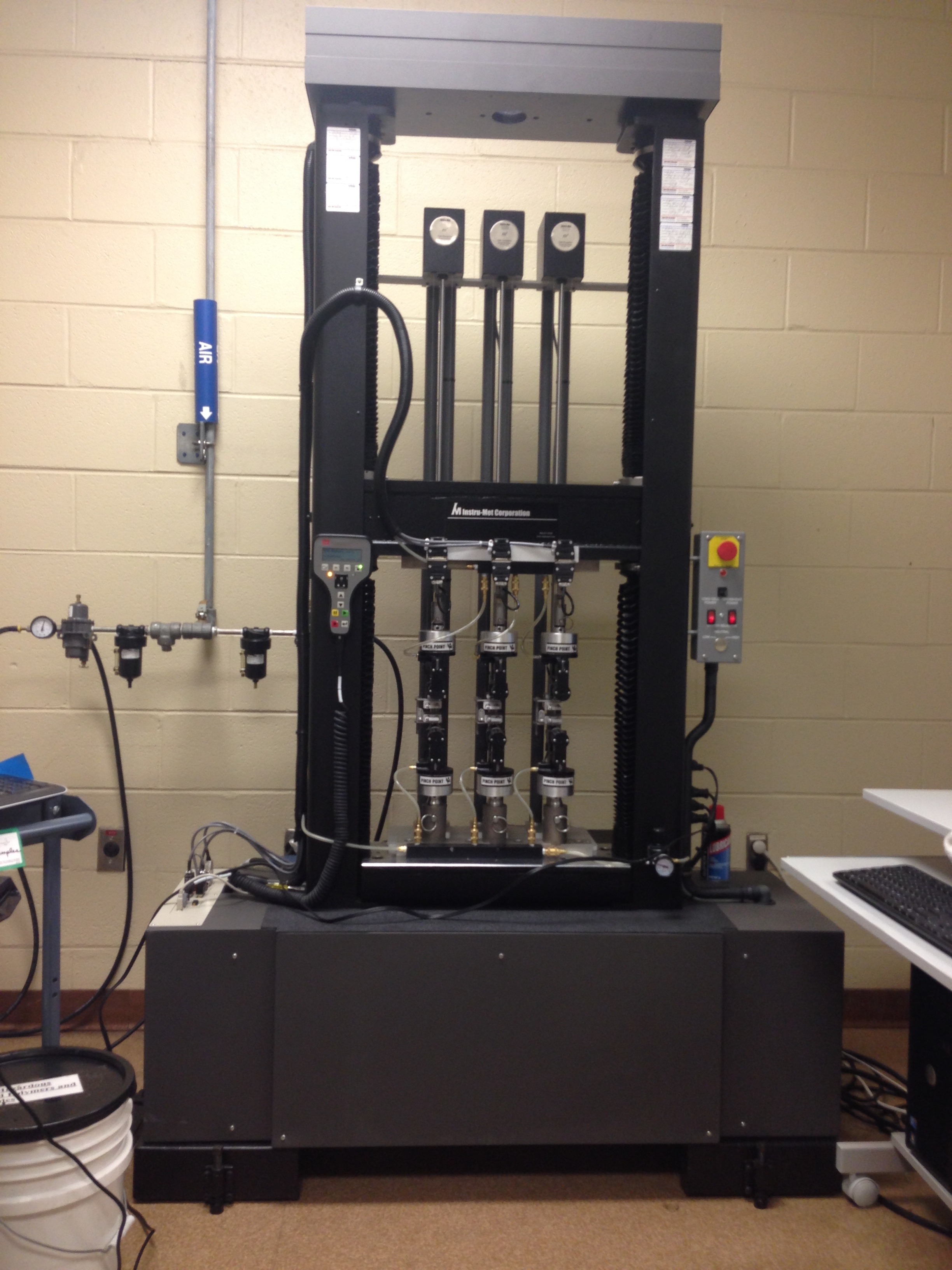 Instron TTD Customized to a High Production Multi-Head Tensile Tester